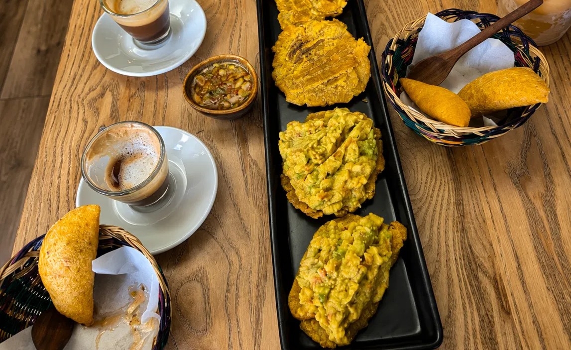 Patacones, empanadas and Colombian coffee on a table at Wild Thing